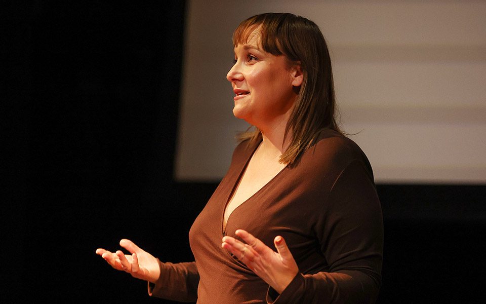 A close-up of a female practitioner speaking at our Illuminate Drama Teacher Conference.