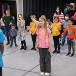 Diverse group of young children play acting at our Family Fun Day.