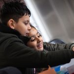 A young boy and girl participating in an arts and craft session at our Family Fun day,