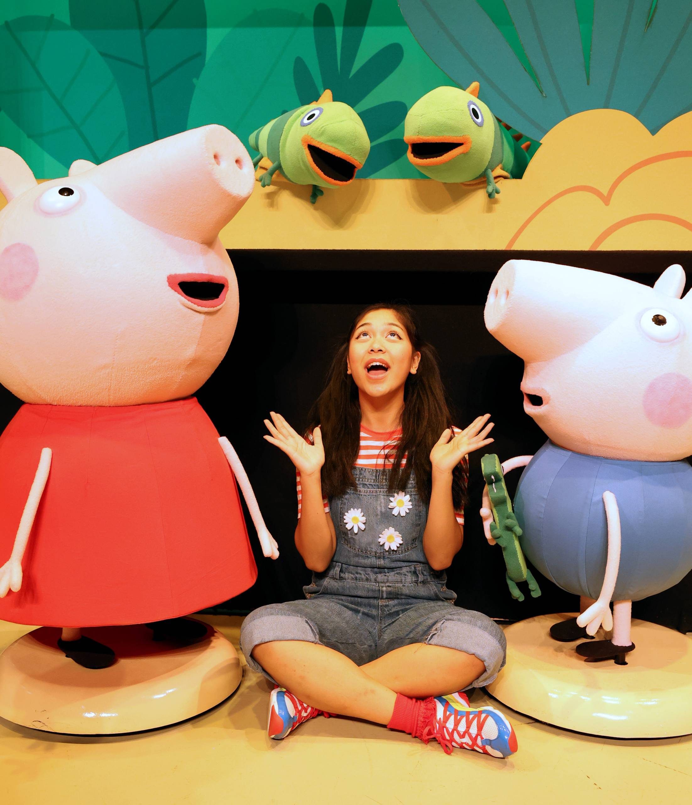 Female character next to Peppa Pig and George.